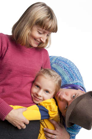 young caucasian husband and wife together with daughter standing with happy bright emotions smiling,...