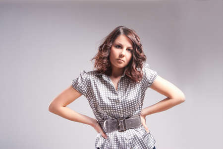 young and sensual caucasian brunette girl standing posing over white background with body shapedの写真素材