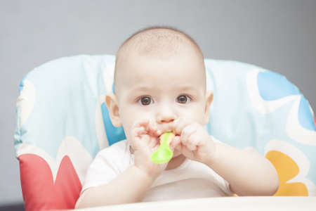 happy looking young caucasian little tot with playful behaviour