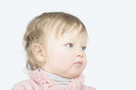 head portrait of caucasian female toddler looking aside over white background