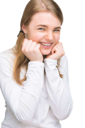 portrait of little girl laughing expressively. vertical shotの写真素材