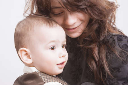 Portrait of Mother and Child together. Over White Background. Horizontal Shot