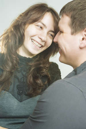 Portrait of Young Caucasian Couple Together Having Fun.Vertical Shot