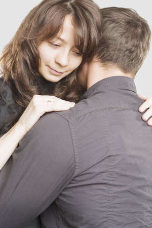 Cute Portrait of Young Caucasian Couple Together Embracing.Vertical Shot