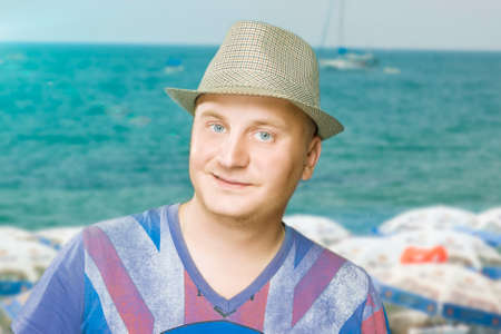 Portrait of Handsome Man on Sea resort Smiling. Composite Image. Horizontal Shotの写真素材