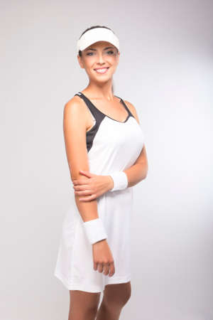 Natural Portrait of Happy smiling Caucasian Tennis Player in Professional Gear. Vertical Imageの写真素材