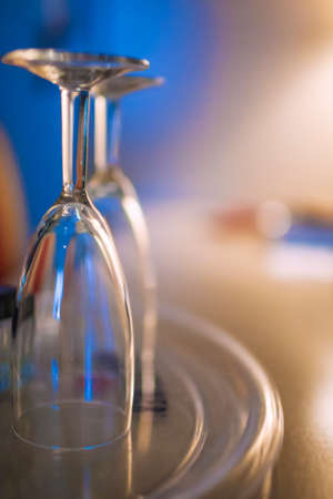 A Couple of Wineglasses Placed On Table. Blurred Background. Vertical Image