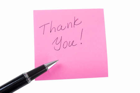 Pink Sticky Note With Thank you! Written Text  On It and a Luxury Pen. Isolated Over white