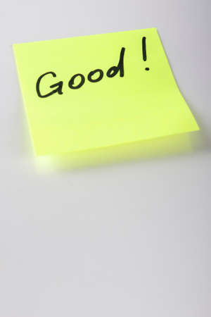 Yello Sticky Note With "Good!" Written Text On It. Vertical Imageの写真素材