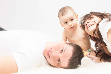 Family Concept: Family of Three People Together Smiling and Having a Good Time. Horizontal Imageの写真素材