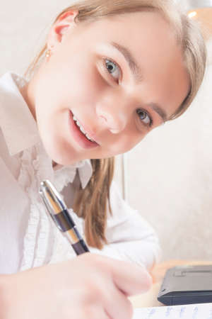 Portrait of Happy Caucasian Teenager Wrtiing. Vertical Imageの写真素材