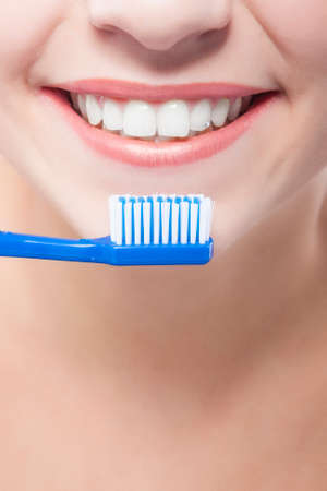 Female Mouth Closeup with Toothbrush. Vertical Image
