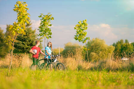 Mountain Bikers Having a Strall in Summer Forest  Horizontal Imageの写真素材