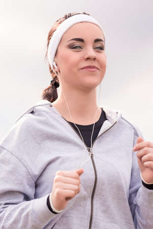 Jogging Sport Concept: Running Fitness Woman Training Outdoors. Vertical Imageの写真素材