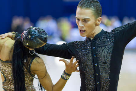 Minsk-Belarus, October 4,2014: Unidentified Professional dance couple performs Adult Latin-American program on World Open Minsk-2014 WDSF Championship in October 4, 2014 in Minsk, Republic Of Belarusのeditorial素材
