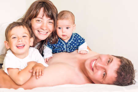 Happy caucasian Family of Four People Together Indoors. Horizontal Imageの写真素材