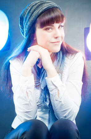 Portrait of Smiling Happy Caucasian Female Wearing Winter Hat and Scarf in Studio...