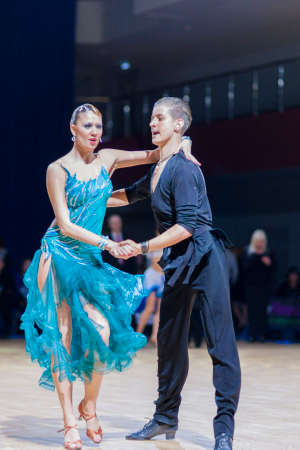 Minsk-Belarus, December 20, 2014: Professional belarussian dance couple of Tchernetzov Danila and Kushner Dariya performs Youth-2 Latin-American program on Gold of The Capital International IDSA Tournament on December 20, 2014, in Minsk, Republic of Belarのeditorial素材