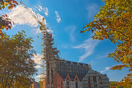Construction Site of New Building in Fall Season Against Blue Sky. HDR Image Toning. Horizontal Compositionの写真素材