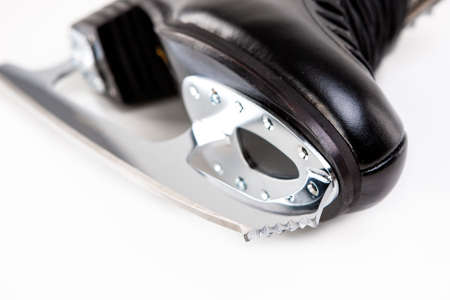 Closeup Shot of Sharp Cog of Professional Male Figure Skate. Over White Background. Horizontal Image...