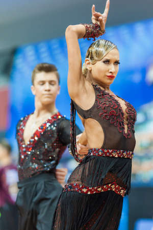 Minsk, Belarus-February 14,2015: Unidentified Professional Dance Couple Performs Youth-2 Latin-American program on IDSA World Professional 10 Dance Championship on February 14, 2015, in Minsk, Republic of Belarusのeditorial素材