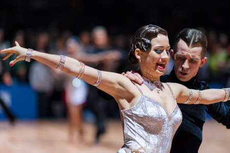 Minsk, Belarus-February 14,2015: Professional Dance Couple of Korostashov Denys and Kostyleva Natallia from Greece Performs Adult Latin-American program on IDSA World Professional 10 Dance Championship on February 14, 2015, in Minsk, Republic of Belarusのeditorial素材
