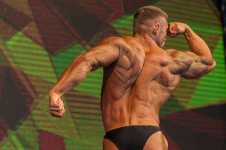Minsk-Belarus, April, 26: Professional Male Caucasian Bodybuilder Performing on Stage during Bodybuilding and Fitness Championship of the Republic of Belarus on April, 26, 2015 in Minsk, Republic of Belarusのeditorial素材