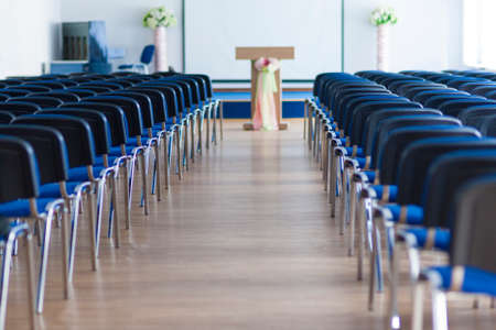 Line of Chairs in the Empty Auditorium Arranged in Two Sections. Horizontal Imageのeditorial素材