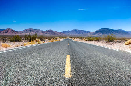 Traditional American Highway Among High Mountains to Death Valley Area. Horizontal Image Compositionの写真素材