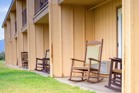 Backyard of American Motel Environment with Row of Chairs in Line. Horizontal Imageの写真素材