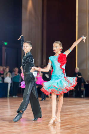 Minsk, Belarus âSeptember 26, 2015: Barbos Florin and Jarbuzov Iolanta Perform Juvenile-1 Latin-American Program on III International IDSA World Dance Championship Capital Cup Minsk- 2015 on September 26, 2015, in Minsk, Belarusのeditorial素材