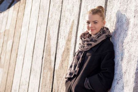 Portrait of Happy and Smiling Positive Caucasian Female Teenager Posing in Casual Clothing Outdoors....