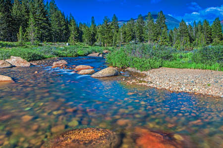 Mountain River and Stones in Yosemite National Park in California. Long Shutter Speed Used. Horizontal Image Orientationの写真素材