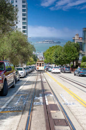 San-Francisco-United States, July 13, 2014: Authentic San-Francisco Tram Ascending Uphill With People on July 13, 2014 in San-Francisco, California, United States Of Americaのeditorial素材