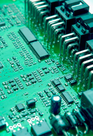 Closeup of Printed Circuit Board with Mounted Components. Vertical Image Orientation