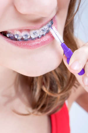 Dental Hygiene Concepts. Closeup Shot of Caucasian Teenage Girl Using Bristle Teeth Brush for...