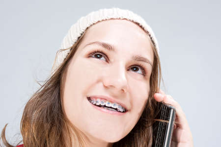 Dental Cure, Orthodontics Concept and Ideas. Blond Caucasian Teenager Wearing Teeth Braces and...