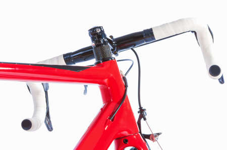 Bicycle Concept. Partial View of Professional Road Bike Handlebars With White Grip Tape. Against...