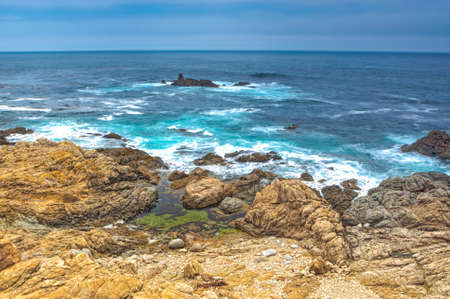 Travel Concepts. Astonishing View of Pacific Shoreline Located Alongside of Prominent Highway Number 1 In California. Horizontal Image Orientationの写真素材
