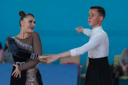 Minsk, Belarus-April 3, 2016: Unidentified dance couple Performs Juvenile-2 Latin-American Program on IDSA Championship Kinezis Star Cup - 2016 in April 3, 2016, Minsk, Republic of Belarusのeditorial素材