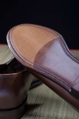 Footwear Concepts. Backside View of Penny Loafer Natural Leather Sole. Vertical Imageの写真素材