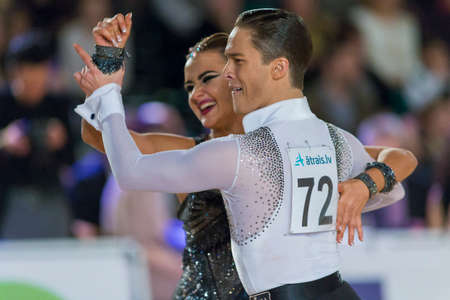 Riga, Latvia-December 17, 2016: Unidentified Adult Dance Couple Performs Youth Latin-American Program on the WDSF Baltic Grand Prix-2106 Championship in December 17, 2016 in Riga, Latvia.のeditorial素材
