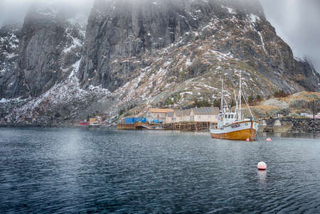 Beautiful Picturesque Harbour Seascape Against Snowy Mountains at Fishing Village at Lofoten in Norway.Horizontal Image Orientationの写真素材
