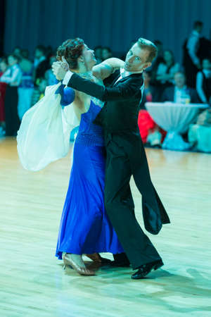 Minsk, Belarus-February 19, 2017: Pro-Am Dance Couple Performs Pro-Am Super Cup International European Standard Program on WDSF Minsk Open Dance Festival-2017 on February 19, 2017 in Minsk, Belarus.のeditorial素材