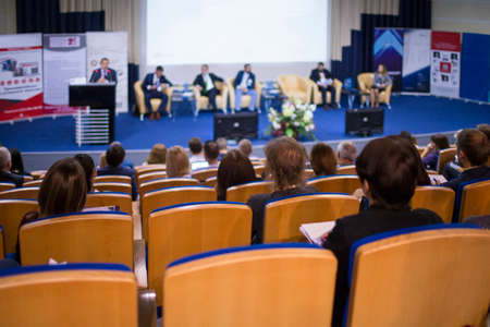 Business Concepts. Male Host Speaking On Stage During Business Conference in Large Congress Hall. Ideas Entrepreneurship. Horizontal image Compositionの写真素材