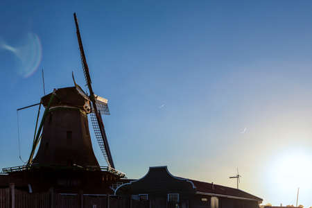 Travelling Ideas. View of Traditional Wooden Dutch Windmills at the Zaan River in Zaanse Schans, Holland, The Netherlands. Horizontal Imageの写真素材