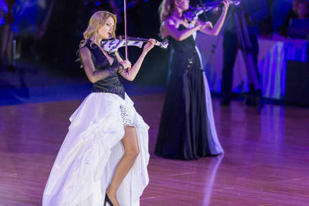 Minsk, Belarus-October 7, 2017: Palladium Electric Band Female Violinist Elena Polyakova Performing on WDSF International Capital Cup Minsk,October 7,2017, Minsk,Belarus.のeditorial素材