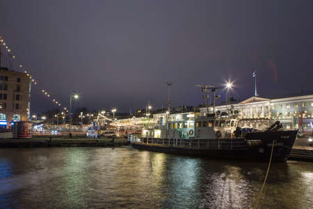 Helsinki, Finland - December 28, 2017: Central Quay of Helsinki in Front of the Famous City Market Hall (Hall Vanha Auppahalli) Opened in 1889 and Designed by Gustaf Nystrom in Helsinki, Finlandのeditorial素材