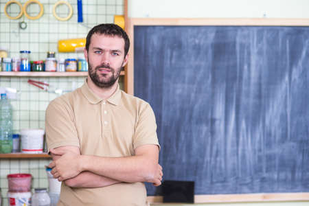 Portrait of Caucasian Handsome Man in Workshop.Horizontal Image
