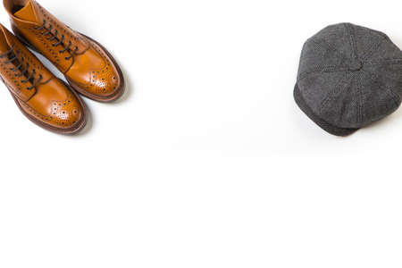 Footwear Ideas. Pair Of Separate Luxury Tan Brogue Boots and Fashion Old School Hat On Pure White...